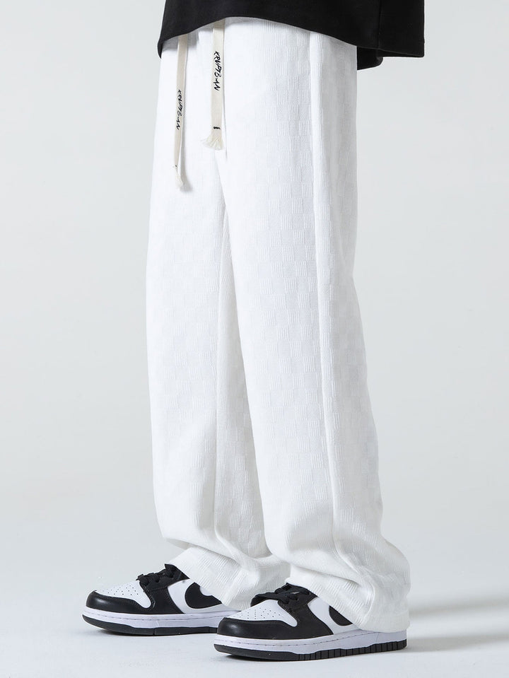 Calças de perna reta texturizadas em padrão xadrez