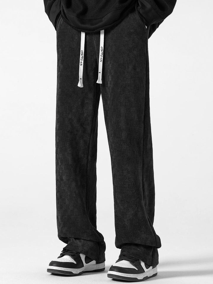 Calças de perna reta texturizadas em padrão xadrez